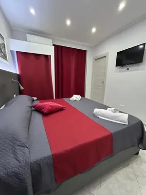 Letto o letti in una camera di Pacini 88 Rooms and apartment Catania Centro