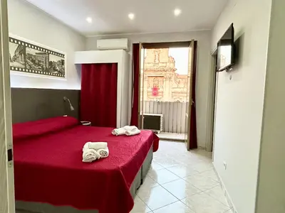 Letto o letti in una camera di Pacini 88 Rooms and apartment Catania Centro