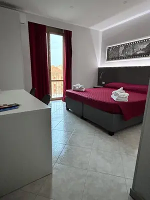 Letto o letti in una camera di Pacini 88 Rooms and apartment Catania Centro