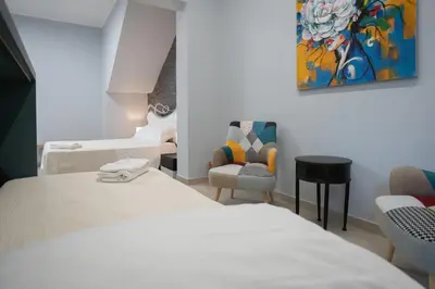 Letto o letti in una camera di iitana Luxury Apartments