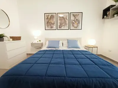 Letto o letti in una camera di Orto Limoni Apartment - quadrilocale Catania Centro