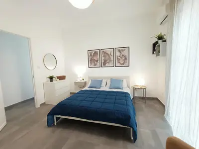 Letto o letti in una camera di Orto Limoni Apartment - quadrilocale Catania Centro