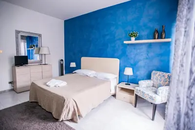 Letto o letti in una camera di Sant'Antonio Garden Rooms Apartments