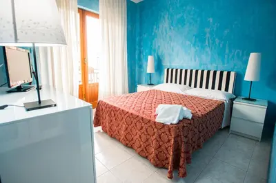 Letto o letti in una camera di Sant'Antonio Garden Rooms Apartments