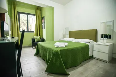 Letto o letti in una camera di Sant'Antonio Garden Rooms Apartments