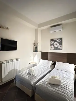 Letto o letti in una camera di La casa di Apollo