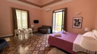 Letto o letti in una camera di Faraone Apartments