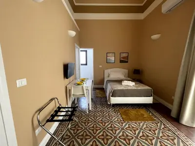 Letto o letti in una camera di Faraone Apartments