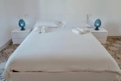 Letto o letti in una camera di Maioliche Apartment