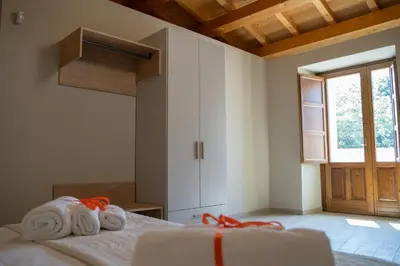 Letto o letti in una camera di Casa Sautu-fau