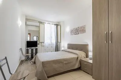 Letto o letti in una camera di GuestHost - Catania Comfy & Central Apartment x3!