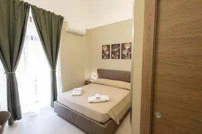 Letto o letti in una camera di CATANIA CENTER B&B