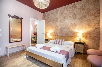 Letto o letti in una camera di Epimonì B&B