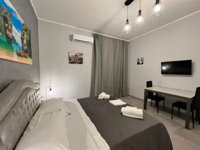 Letto o letti in una camera di Holiday House Catania