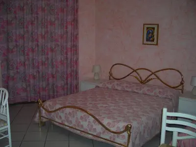 Letto o letti in una camera di B&B Villa Dagala