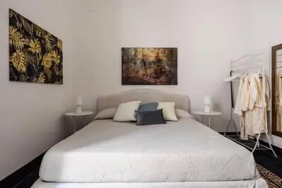 Letto o letti in una camera di Le Dimore del Corso Acireale - Sicily Stay, fra Catania, Taormina, il Mare e l'Etna