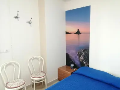 Letto o letti in una camera di Acirealevacanze - Romantica Camera sul Mare