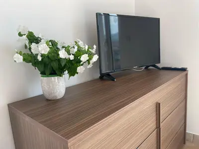 TV o dispositivi per l'intrattenimento presso Maison de Cheeramie - Tourist Apartments Tra Mare e Etna