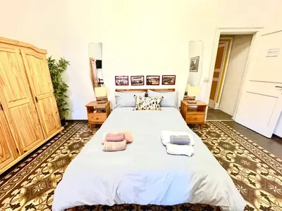 Letto o letti in una camera di AlbaChiara Guesthouse