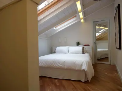 Letto o letti in una camera di Ferrini Home - Piazza Trento