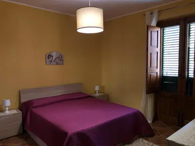 Letto o letti in una camera di Casa Francesco
