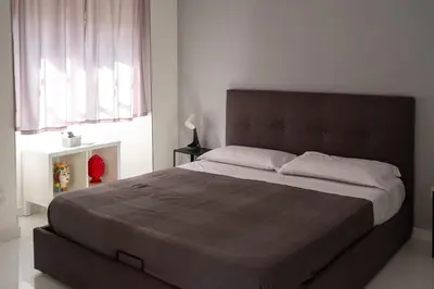 Letto o letti in una camera di Casa Galè - House in Catania Center