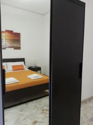 Letto o letti in una camera di La Via del Mare - Acireale Centro storico