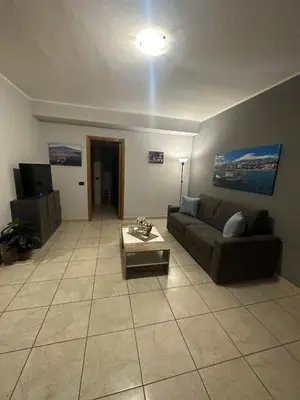 Area soggiorno di Le radici dell’Etna holiday house