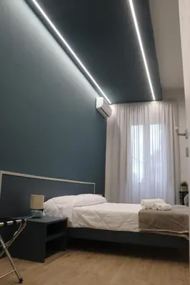 Letto o letti in una camera di IOLETTA HOUSE