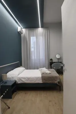 Letto o letti in una camera di IOLETTA HOUSE