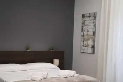 Letto o letti in una camera di IOLETTA HOUSE
