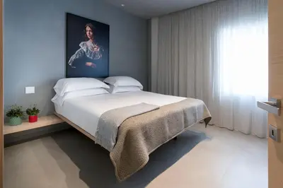 Letto o letti in una camera di Catania Smart Apartments
