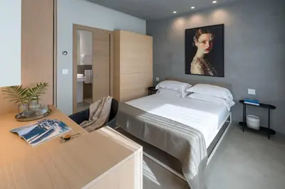 Letto o letti in una camera di Catania Smart Apartments