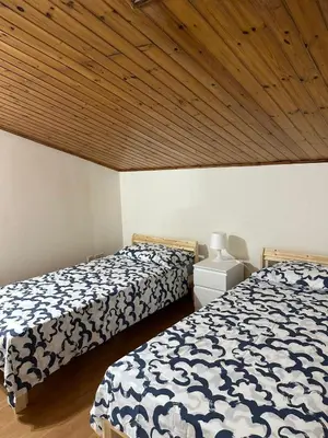 Letto o letti in una camera di La mansarda di melo