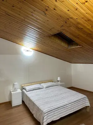 Letto o letti in una camera di La mansarda di melo