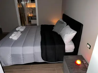 Letto o letti in una camera di Le suite del corso Italia
