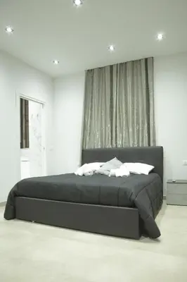 Letto o letti in una camera di Le suite del corso Italia