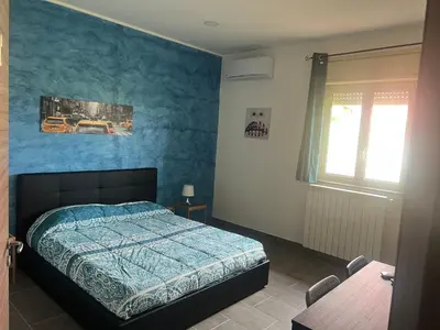 Letto o letti in una camera di Etna &Vita