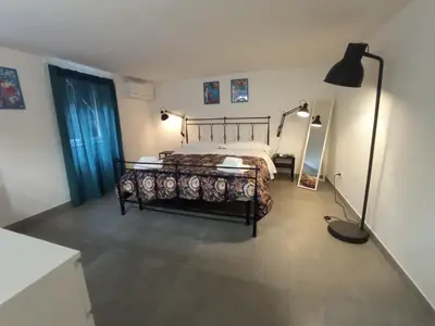 Letto o letti in una camera di GrotteBianche - Sicilian Apartment