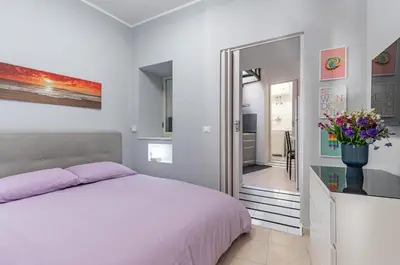 Letto o letti in una camera di GuestHost - Villa Bellini & Stadio Comfy Apartment