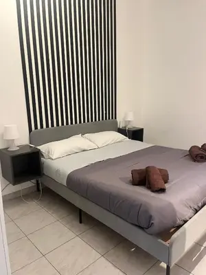 Letto o letti in una camera di Mongibello Apartment