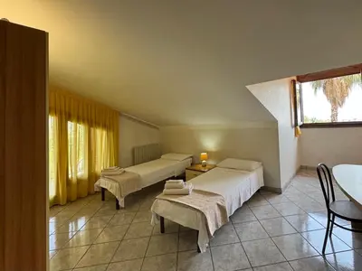 Letto o letti in una camera di Villa esclusiva con piscina privata e vista Etna