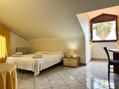 Letto o letti in una camera di Villa esclusiva con piscina privata e vista Etna