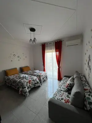 Letto o letti in una camera di SALOTTO DELL'ETNA