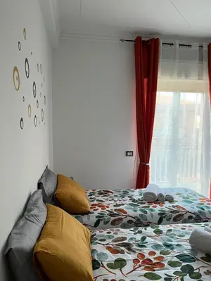 Letto o letti in una camera di SALOTTO DELL'ETNA