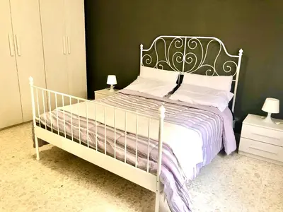 Letto o letti in una camera di CITTÀ MARE