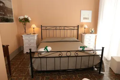Letto o letti in una camera di Casa Elide