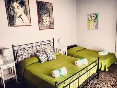 Letto o letti in una camera di Casa Elide