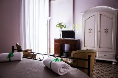 Letto o letti in una camera di Casa Elide