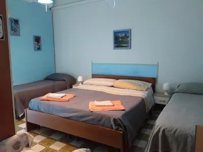 Letto o letti in una camera di Stanza 30 euro per 2 ore Acireale